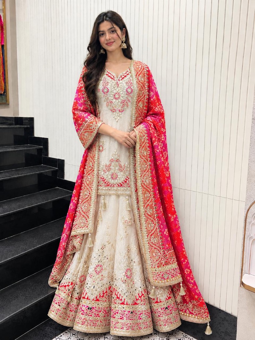 Noor-e-Qamar sharara set with a red and pink bandhani dupatta